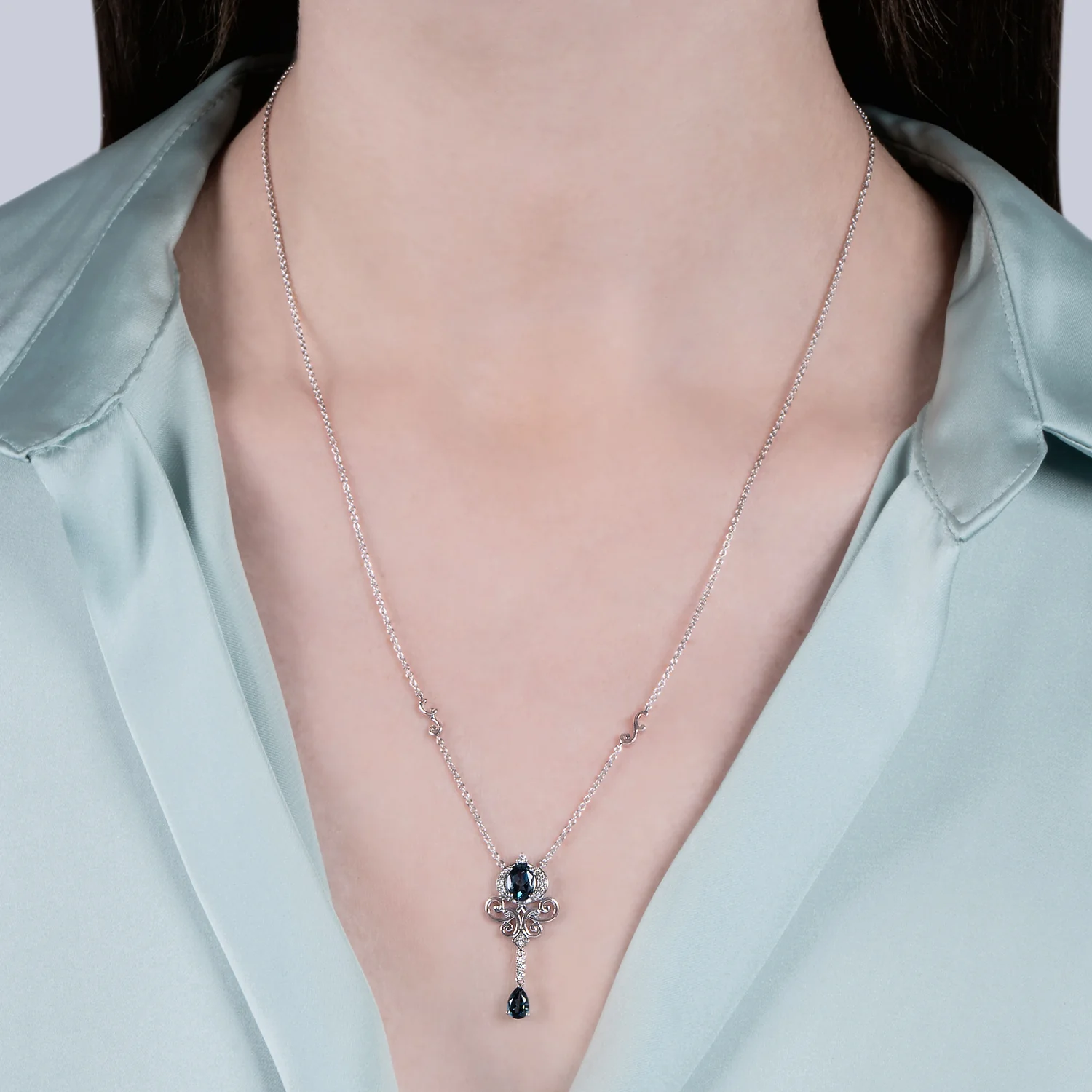 Enchanted Disney Fine Jewelry Sterling Silver with 1/10 CTTW Diamond and London Blue Topaz Cinderella Necklace - Image 2